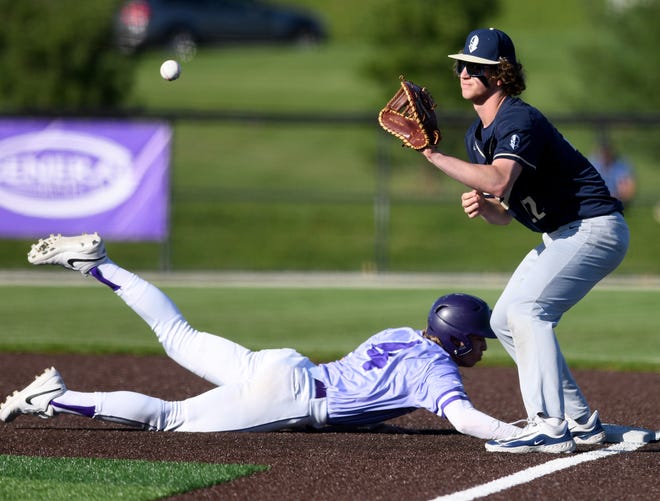 Jackson's Kyle Andrews beats a tag by Hoban first base Andrew Karhoff in the 2nd inning of Hoban at Jackson baseball. Thursday, April 18, 2024.